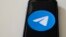 file - This illustration picture taken on Aug. 16, 2019 in Paris shows a smartphone showing the Telegram app logo.