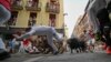 Seorang peserta acara &quot;lari bersama banteng&quot; tampak terjatuh pada hari keenam lomba lari dengan banteng pada festival San Fermín di kota Pamplona, ​​Spanyol. (AP)&nbsp;