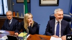 Italian Premier Giorgia Meloni, center, in Rome, April 13, 2023. Meloni has acknowledged "anomalies" in the handling of a Russian businessman who escaped from house arrest in Italy to avoid extradition to the United States.