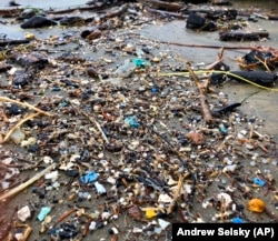 This Jan. 19, 2020 photo shows microplastic debris that has washed up at Depoe Bay, Ore. Dozens of scientists from around the U.S. West will attend a gathering this week in Bremerton, Wash., to better focus the research on the environmental threat. (AP Photo/Andrew Selsky)