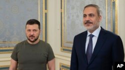 Ukrainian President Volodymyr Zelenskyy, left, and Turkish Foreign Affairs Minister Hakan Fidan are pictured before their meeting in Kyiv, Ukraine, Aug. 25, 2023. (Ukrainian Presidential Press Office via AP)