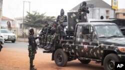 FILE - Military forces secure an area in Anambra, Nigeria, Feb. 24, 2023.
