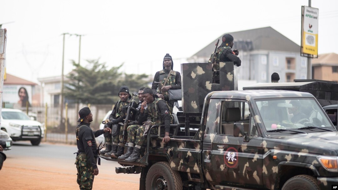 FILE - Military forces secure an area in Anambra, Nigeria, Feb. 24, 2023. On May 16, 2023, armed men attacked a U.S. embassy convoy in southeast Anambra state.