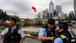 香港立法会通过根据《基本法》第23条订立的新的国家安全法案期间，香港警察在立法会外站岗。（2024年3月19日）（2024年3月19日）