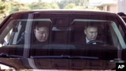 FILE - Russian President Vladimir Putin and North Korean leader Kim Jong Un drive a limousine during their meeting in Pyongyang, North Korea, June 19, 2024. NATO is expected to discuss the Russia-North Korea relationship at its summit July 9 to 11, 2024. (Kremlin photo via AP) 