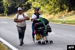 Migrant people take part in a caravan towards the border with the United States in Mapastepec, Chiapas state, Mexico, Dec. 27, 2023.