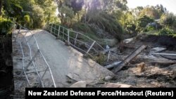 A general view of a damaged bridge after a small creek bursts its bank causing houses to flood in Havelock North, New Zealand, Feb. 18, 2023. 
