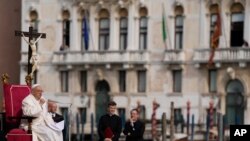 Pope Francis delivers his message as he meets with young people in front of the Church of the Salute in Venice, April 28, 2024. 