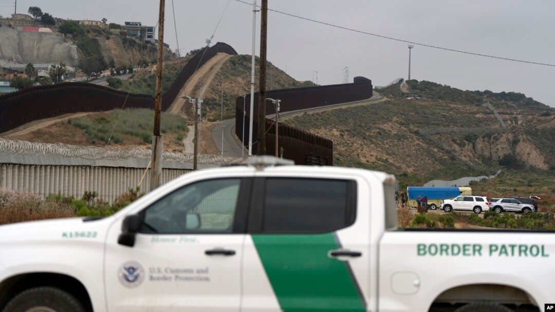 A Border Patrol vehicle sits near border walls separating Tijuana, Mexico, from the United States, June 4, 2024, in San Diego. 