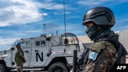 FILE - A peacekeeper of the United Nations Organization Stabilization Mission in the Democratic Republic of the Congo (MONUSCO) looks on at the force's base during a field training exercise in Sake, eastern Democratic Republic of Congo, Nov. 6, 2023.