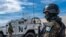 FILE - A peacekeeper of the United Nations Organization Stabilization Mission in the Democratic Republic of the Congo (MONUSCO) looks on at the force's base during a field training exercise in Sake, eastern Democratic Republic of Congo, Nov. 6, 2023.