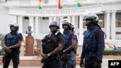FILE - Policemen stand guard in front of Ghana's Supreme Court in Accra, Aug. 29, 2013. The court is holding a hearing on an injunction seeking to overturn a contested law that severely curtails LGBTQ rights.