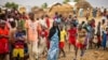 FILE - Refugees are seen gathered at Minawao refugee camp in northern Cameroon, April 18, 2016. 