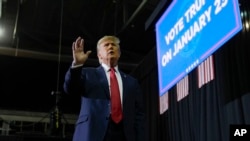 Republican presidential candidate former President Donald Trump gestures to the crowd after speaking at a campaign event in Manchester, New Hampshire, Jan. 20, 2024.