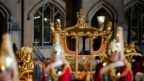 The Gold State Coach is led in a procession as it leaves Westminster Abbey in central London, May 3, 2023 during a rehearsal for the Coronation of King Charles III.