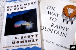 FILE - "House Made of Dawn" and "The Way to Rainy Mountain" by N. Scott Momaday are seen in his home in Santa Fe, New Mexico, Nov. 13, 2019.