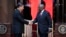 Chinese President Xi Jinping, left, shakes hand with South Africa's President Cyril Ramaphosa after their joint media briefing at Union Building in Pretoria, South Africa, Aug. 22, 2023.