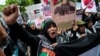 People participate in a pro-Palestinian rally in front of the Israeli Embassy in Bangkok, Oct. 21, 2023. 