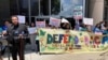 FILE - Demonstrators gather at a rally outside the federal courthouse following a hearing on the fate of a revised version of the Deferred Action for Childhood Arrivals, or DACA, program, in Houston, June 1, 2023.