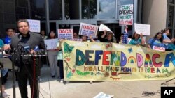 FILE - Maritza Gutierrez Ramos, 28, speaks at a rally outside the federal courthouse following a hearing on the fate of a revised version of the Deferred Action for Childhood Arrivals program, June 1, 2023, in Houston.