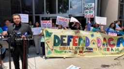 FILE - Maritza Gutierrez Ramos, 28, speaks at a rally outside the federal courthouse following a hearing on the fate of a revised version of the Deferred Action for Childhood Arrivals program, June 1, 2023, in Houston.