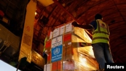Aid supplies from World Health Organization (WHO) and UAE-AID are loaded into a plane for Port Sudan, at the Abu Dhabi International Airport, Abu Dhabi, United Arab Emirates, May 5, 2023. 