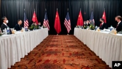 FILE - Sec. of State Antony Blinken, joined by national security adviser Jake Sullivan, speaks to Chinese foreign affairs chief Yang Jiechi and China's State Councilor Wang Yi, left, in Anchorage, Alaska, March 18, 2021.