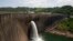 Kariba Dam wall between Zimbabwe and Zambia where hydropower is generated for both nations.