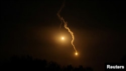 Flares are pictured over Gaza, seen from Sderot in southern Israel, Oct. 27, 2023.