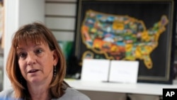 FILE - Sally Otto, owner of a downtown craft collective, speaks May 21, 2024, in Greeley, Colo.