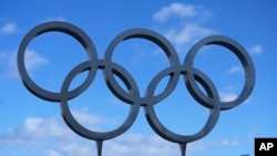 The five rings of the 2002 Winter Olympics are displayed outside Rice-Eccles Stadium in Salt Lake City on April 10, 2024.