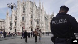 Police patrol in front of Milan Cathedral in Milan, March 25, 2024. Italy followed France Monday in stepping up its security stance following the attack on a suburban Moscow concert hall and the claim of responsibility by an affiliate of the Islamic State group.