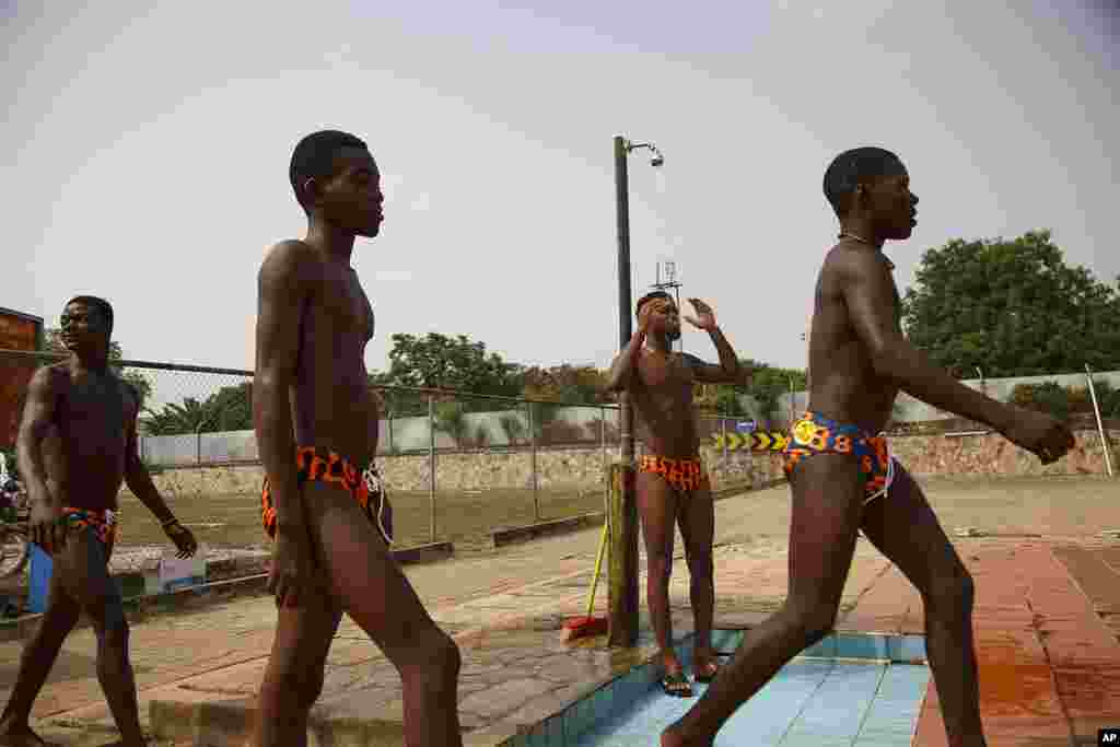 Participants in the Black Star Polo competition, held at the University of Ghana in Accra, Saturday, January 14, 2023, shower before their game. The Awutu Winton Water Polo Club has seven teams representing three regions of Ghana.&nbsp;