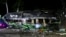 The wreckage of a bus lies on the side of a road following an accident in Subang, West Java, Indonesia, May 11, 2024.