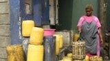 A water vendor fills up jerry cans at a water point at the Mathare slum in Nairobi, Kenya, March 22, 2023.