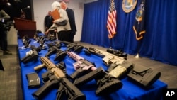 FILE - Ghost guns are displayed for a press conference in New York City, March 15, 2023.