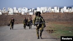 အစ္စရေးတပ်စွဲထားတဲ့ Golan Heights ဒေသအတွင်း စစ်ရေးလေ့ကျင့်နေတဲ့ အစ္စရေးစစ်သားများကိုတွေ့ရစဉ် (အောက်တိုဘာ ၂၅၊ ၂၀၂၃)