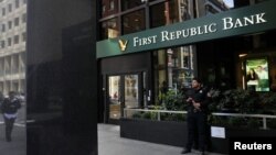 A security guard stands outside a First Republic Bank branch in San Francisco, California, April 28, 2023. 