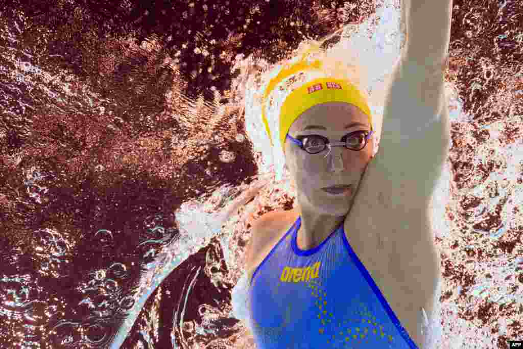 An underwater view shows Sweden&#39;s Sarah Sjoestroem competing in a heat of the women&#39;s 100m freestyle swimming event during the Paris 2024 Olympic Games at the Paris La Defense Arena in Nanterre, west of Paris.