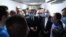 A handout photo released by the press office of Iraq's prime minister on its Facebook page Sept. 28 2023, shows Prime Minister Mohammed Shia al-Sudani (C) meeting at a hospital in Mosul with families of victims of a wedding hall fire.