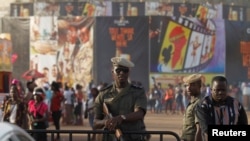 FILE - A soldier stands guard during the Panafrican Film and Television Festival (FESPACO) in Ouagadougou, Burkina Faso March 3, 2017. 