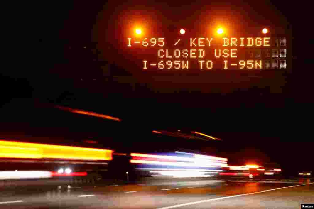 Highway signs direct drivers to a detour for Francis Scott Key Bridge following the bridge&#39;s collapse, in Baltimore, March 26, 2024.