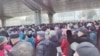 Demonstrators gather outside Zhongshan park to protest changes to medical benefits in Wuhan, China, Feb. 15, 2023 in this still image from social media video.