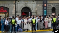 Crowds line the Bund as the motorcade with Secretary of State Antony Blinken drives past in Shanghai, China, April 24, 2024.