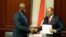 FILE – Outgoing Burundi Prime Minister Alain-Guillaume Bunyoni (right) shaking hands with new leader Gervais Ndirakobuca (left) during the handover of power in Bujumbura, Burundi, September 9, 2022. 