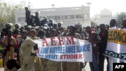 FILE — Protesters from AEEM (Students Association of Mali) on January 9, 2013 in Bamako call for dialogue on the transition in Mali. 