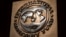 FILE - The logo of the International Monetary Fund is visible on its building in Washington, April 5, 2021. 