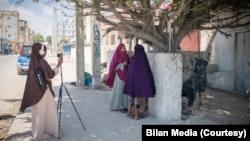Journalists from the Somali women-led newsroom Bilan are seen on assignment. (UNDP/2022/Said Fadhaye)