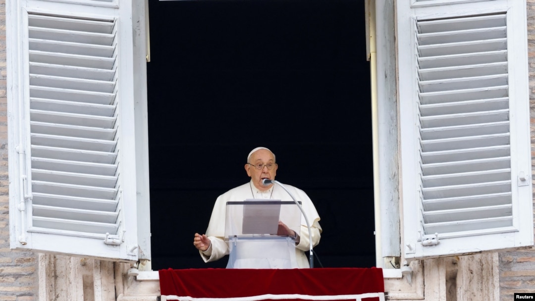 Pope Francis leads the Angelus prayer from his window, in St. Peter's Square at the Vatican, Dec. 24, 2023. 