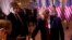 FILE - Barron Trump, left, watches as his father former President Donald Trump greets people after announcing he is running for president for the third time as he speaks at Mar-a-Lago in Palm Beach, Nov. 15, 2022.